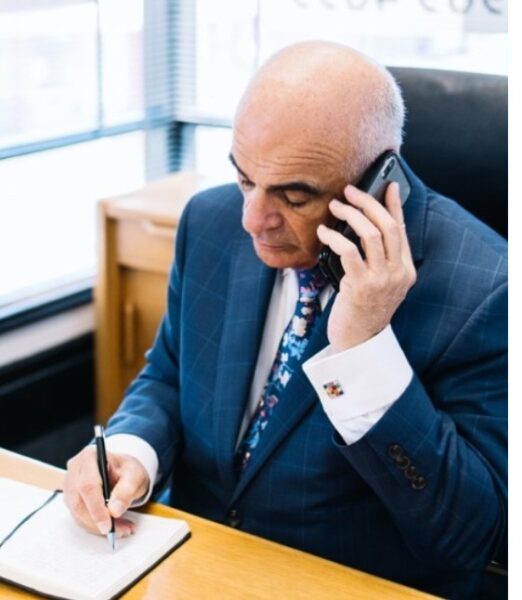 An Experienced Accountant Talking On The Phone